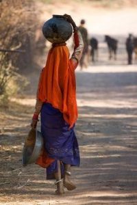 woman carrying water on her head